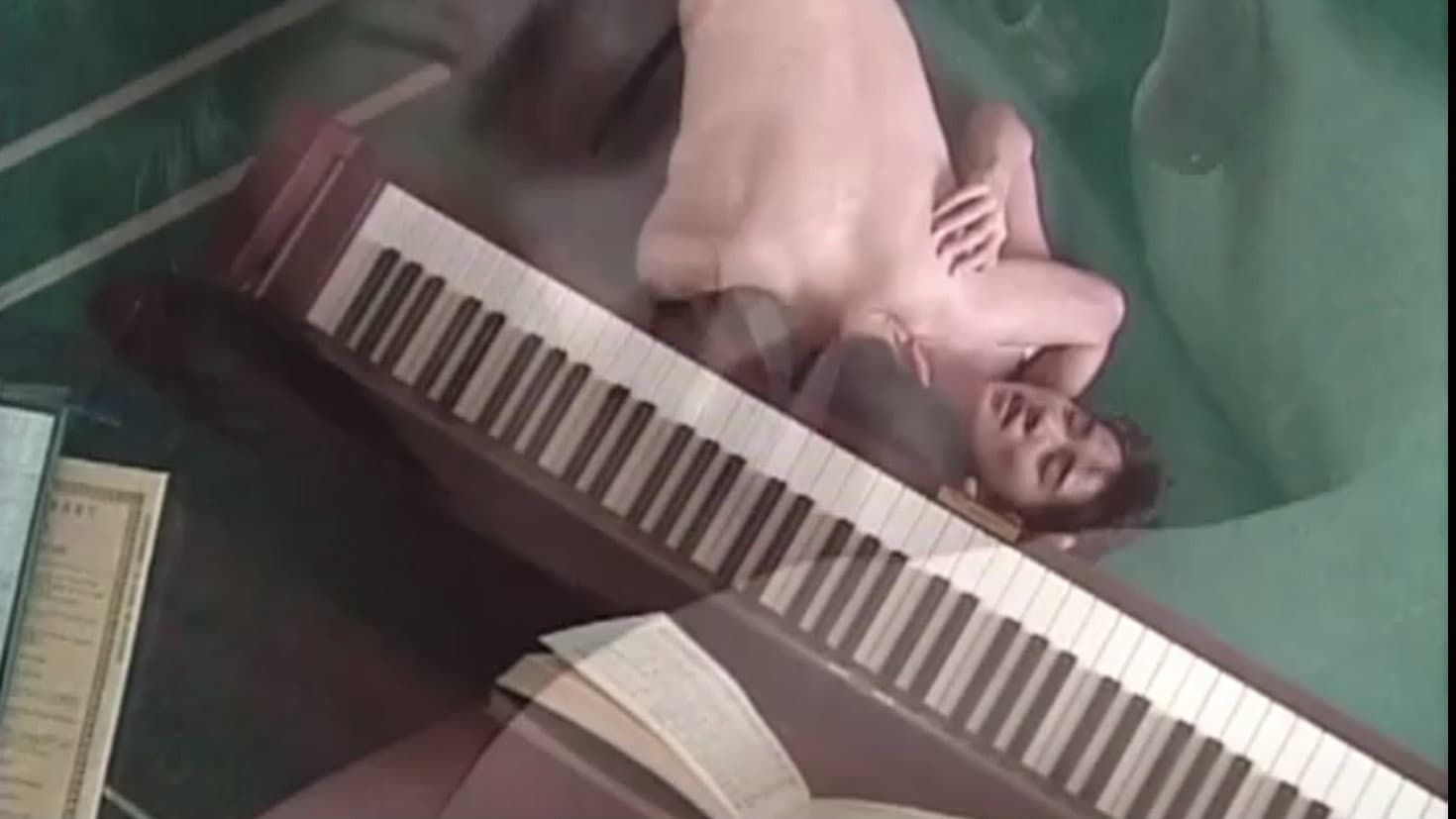 Female Teacher: Under a Wet Piano